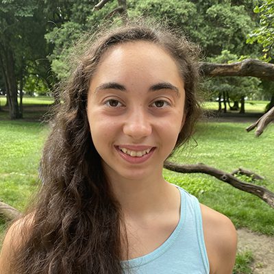 Portrait of Gloria Davidova, a young woman with long, dark hair.