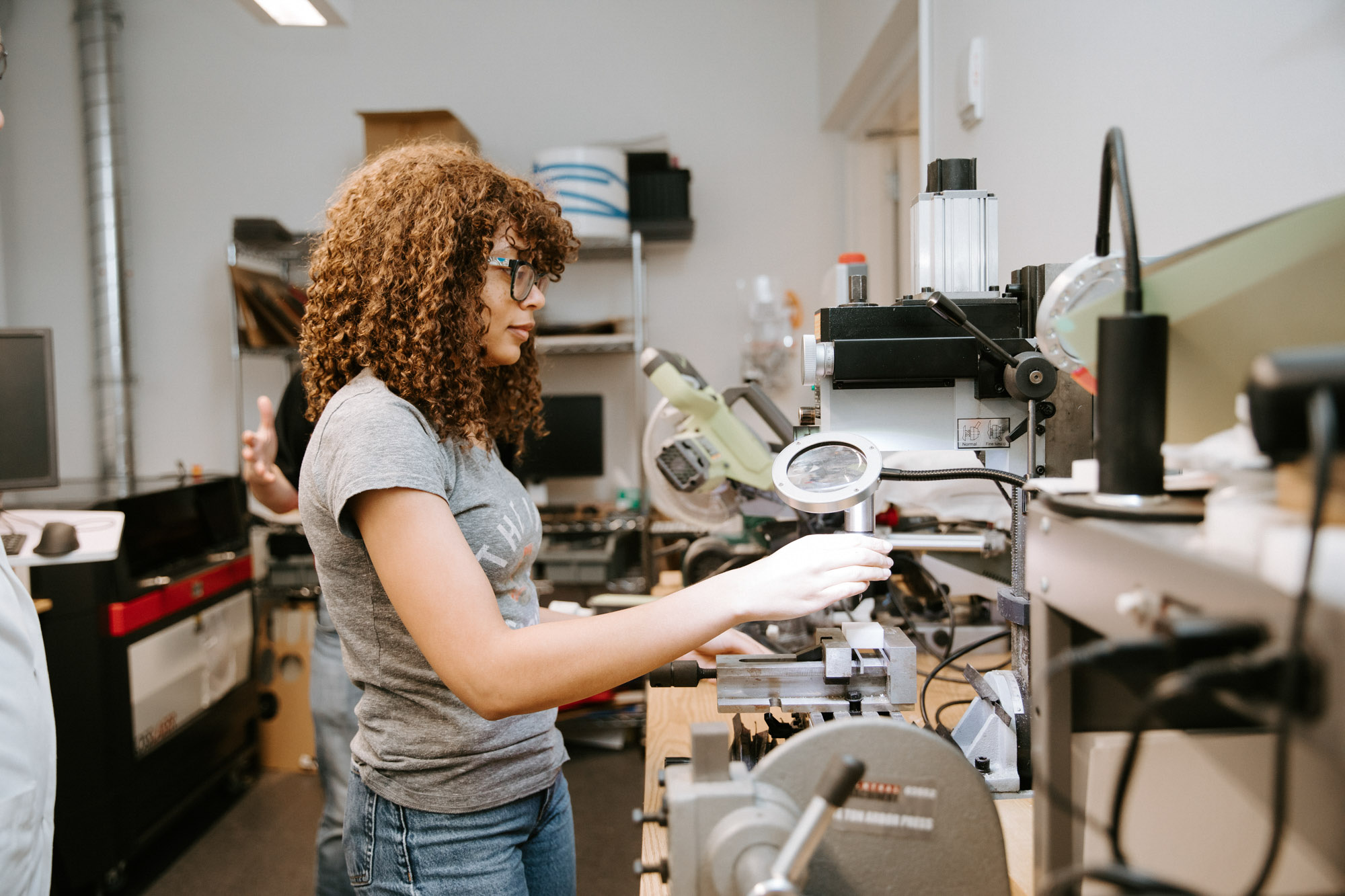 A student with protective goggles working in one of the BME project teams spaces.