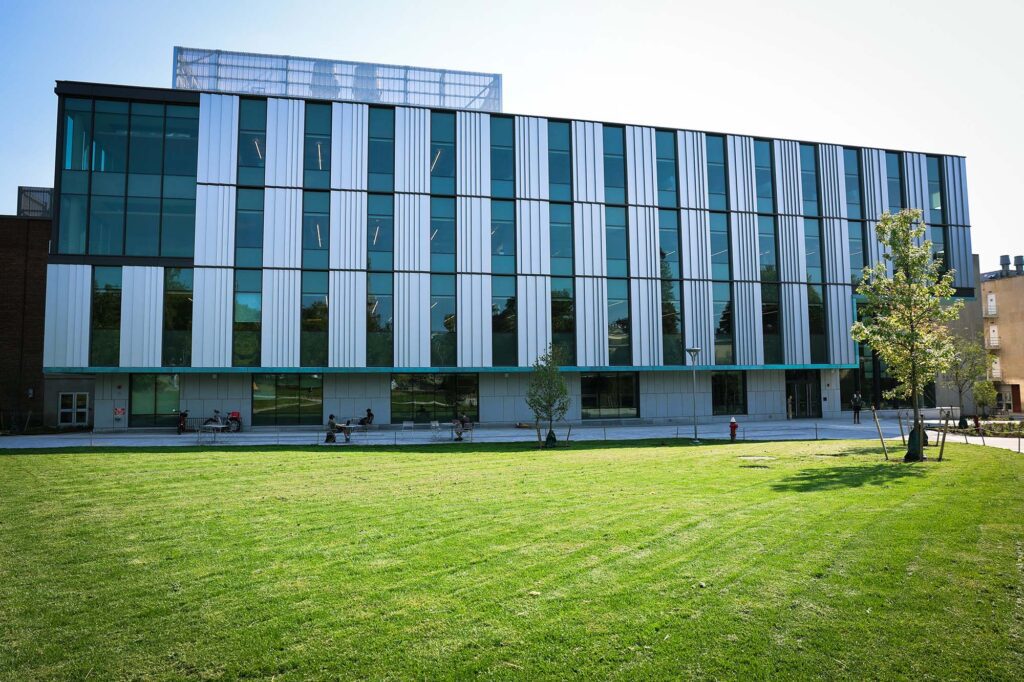 Outdoor view of Tang Hall in summer.