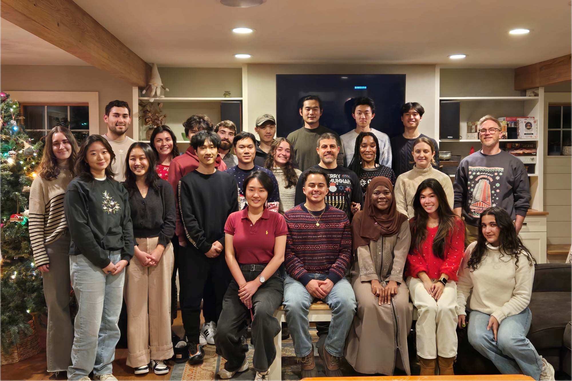 Jonathan Butcher lab stands together in living room