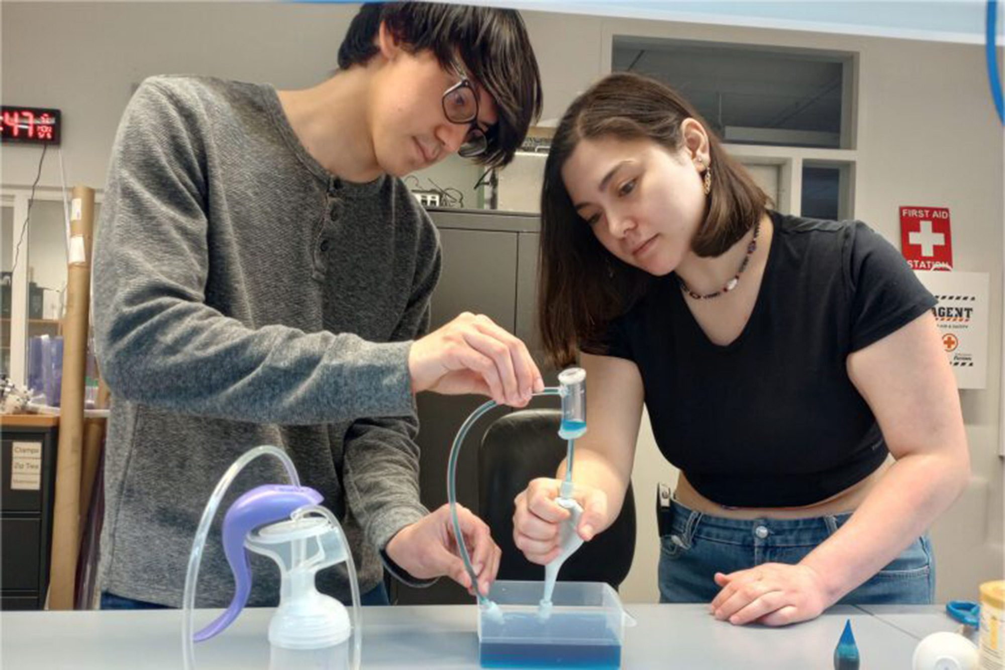 Two students working in a lab