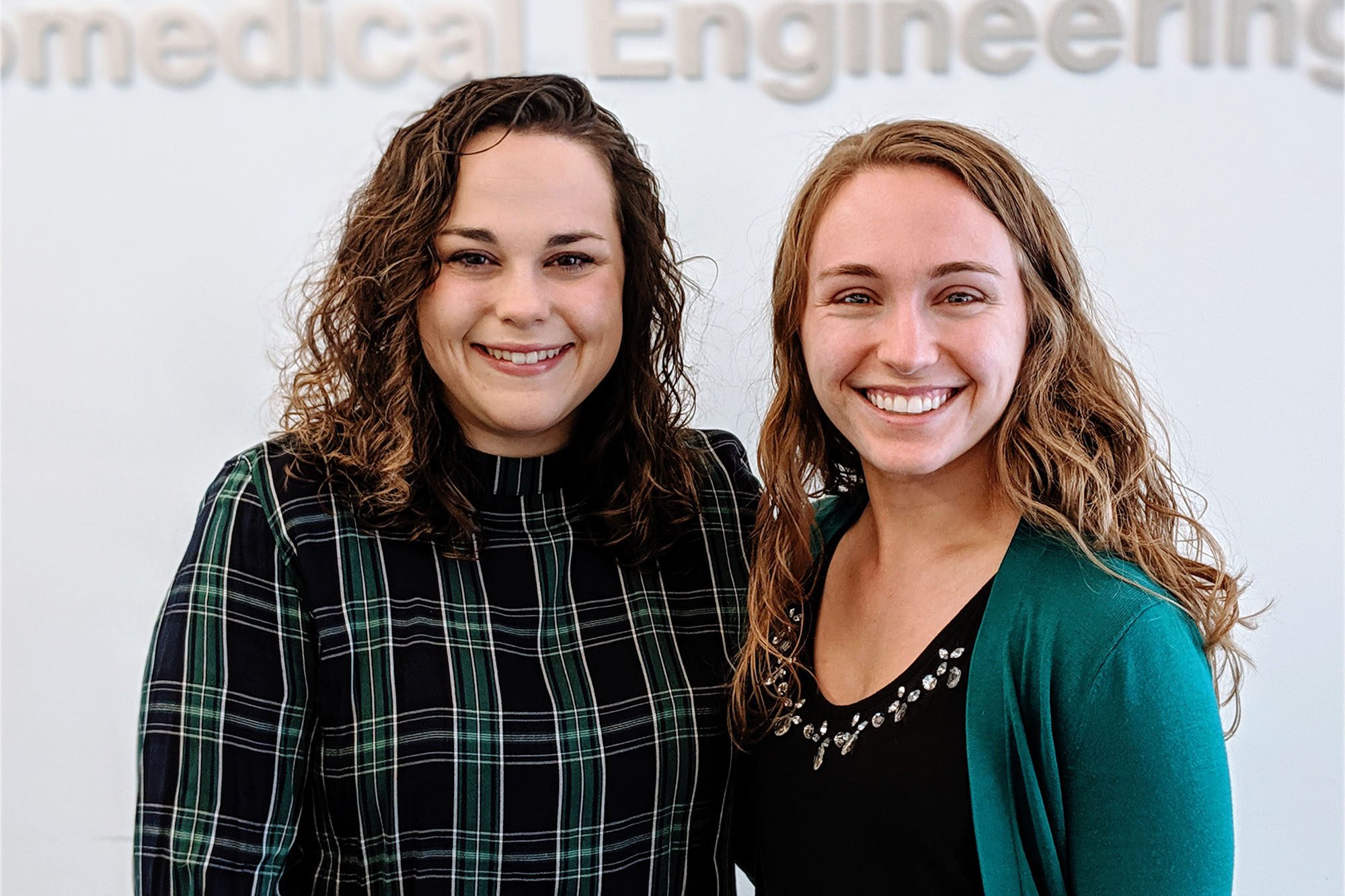 2019 Outstanding Collegiate Member of SWE Haley Antoine Carolyn Chlebek stand together.
