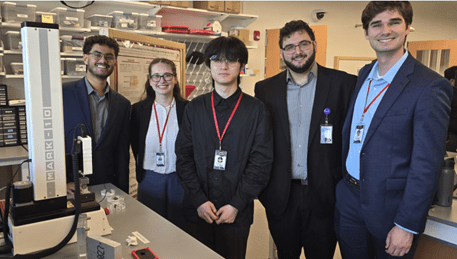 Demonstrating their mechanical test set-up during the project showcase.