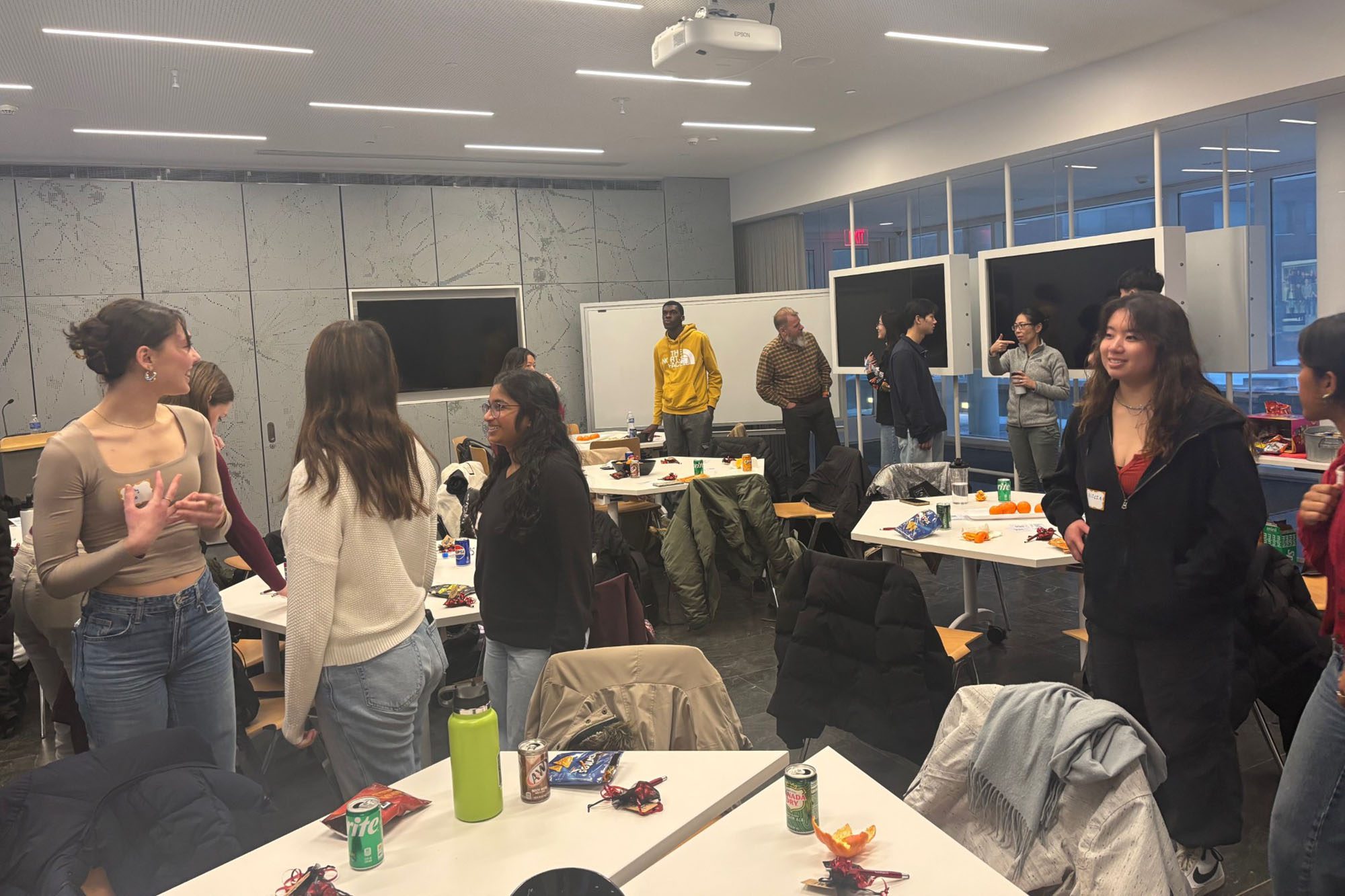 Undergraduates talk and network at an event in Weill Hall.