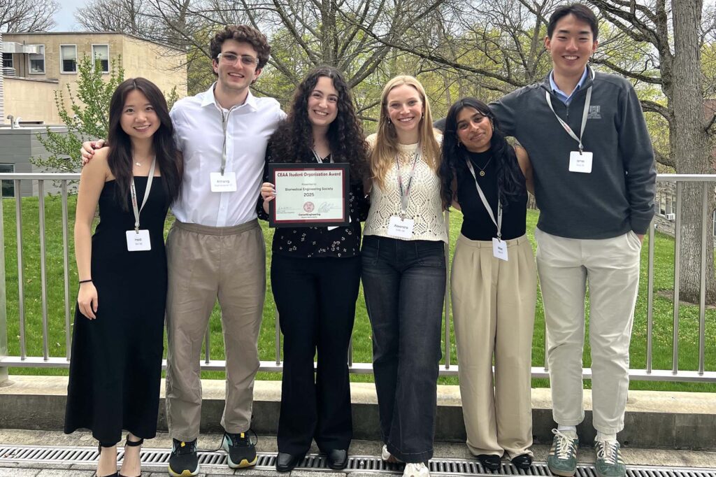 Emma Weiss and her BMES undergraduate group members stand outside together with CREA award.