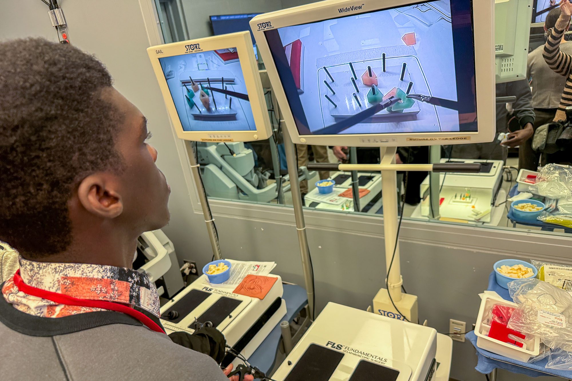 An undergraduate clinical immersion student works with medical equipment in hospital.