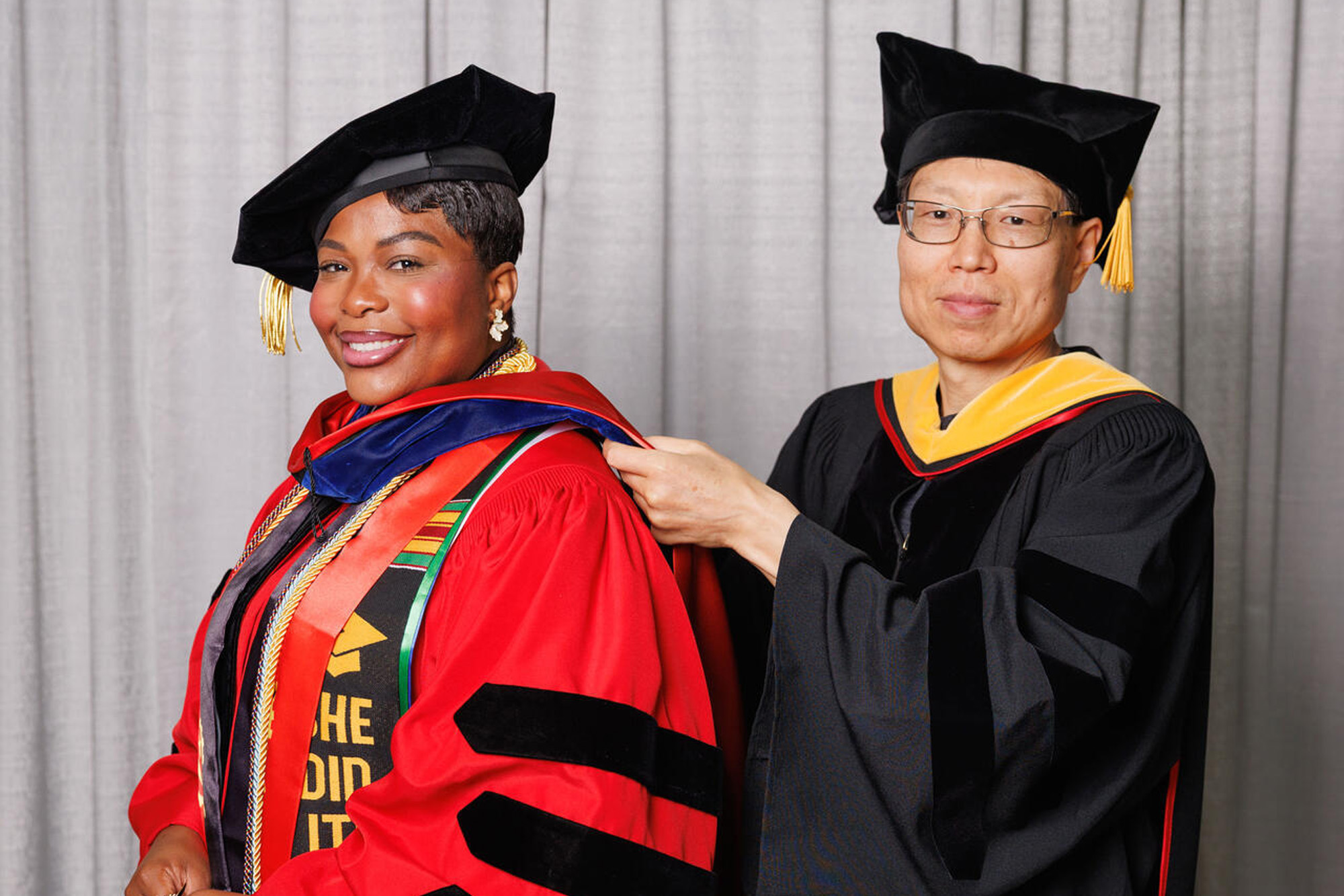Yadong Wang hooding Cátia P. Dombaxe at Ph.D. commencement hooding ceremony 2026