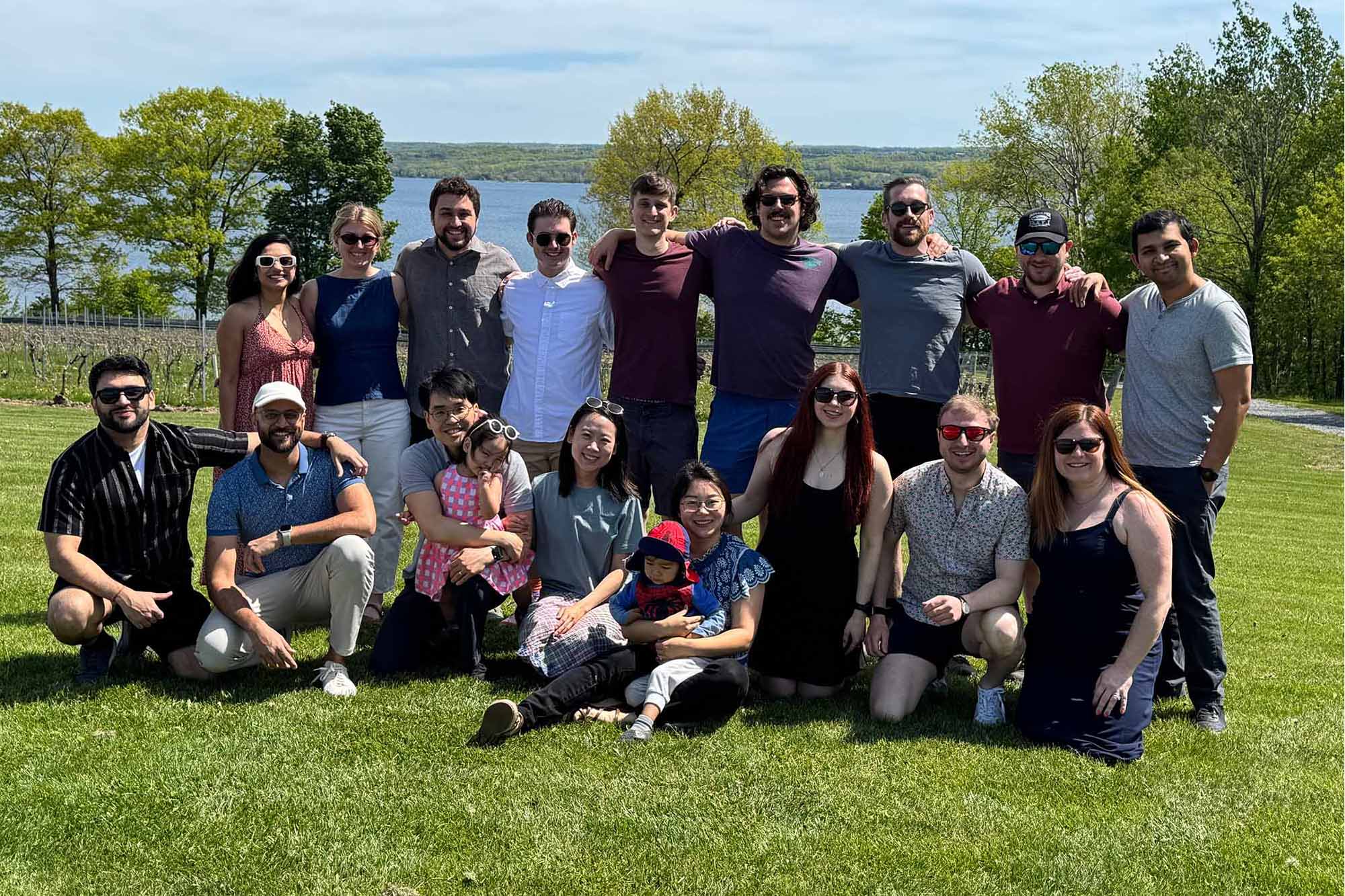 2016 biomedical engineering M.Eng. alumni stand together outside at a Cayuga Lake Winery.