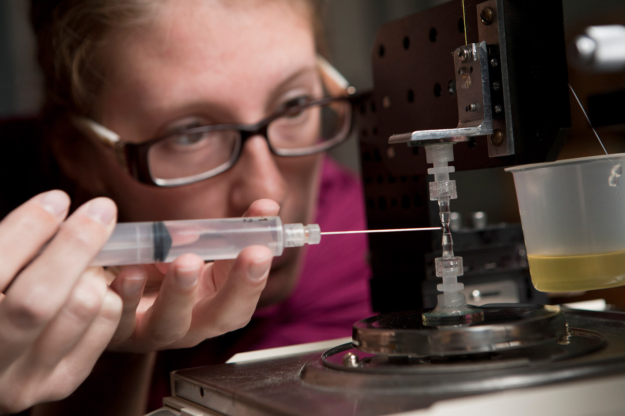 Student working on an experiment in a chemical and biomolecular engineering lab