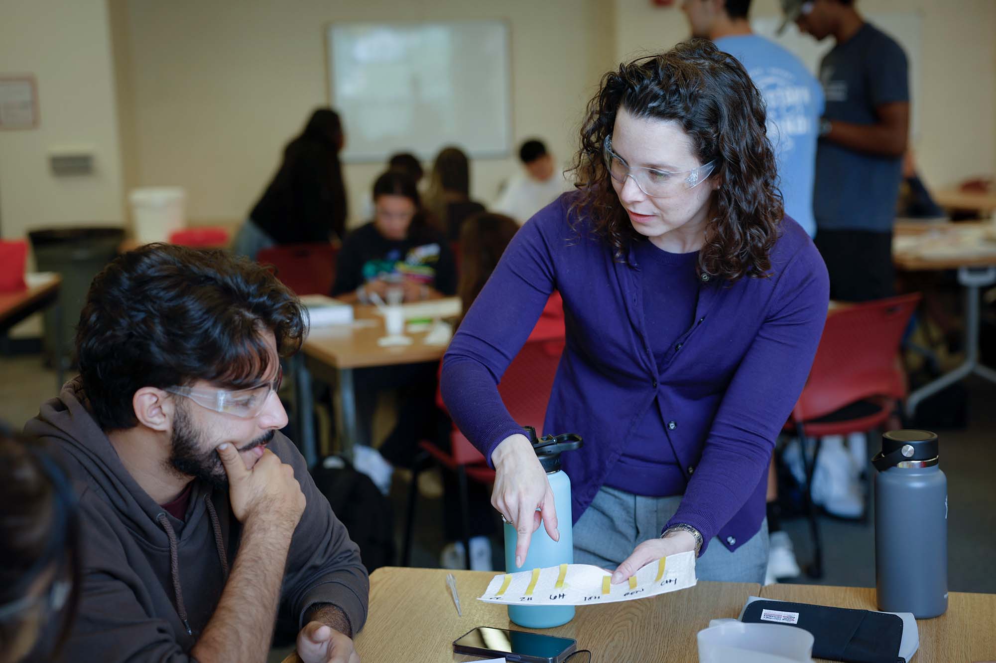 Allison Godwin works with a student in an Engineering education research EER classroom.