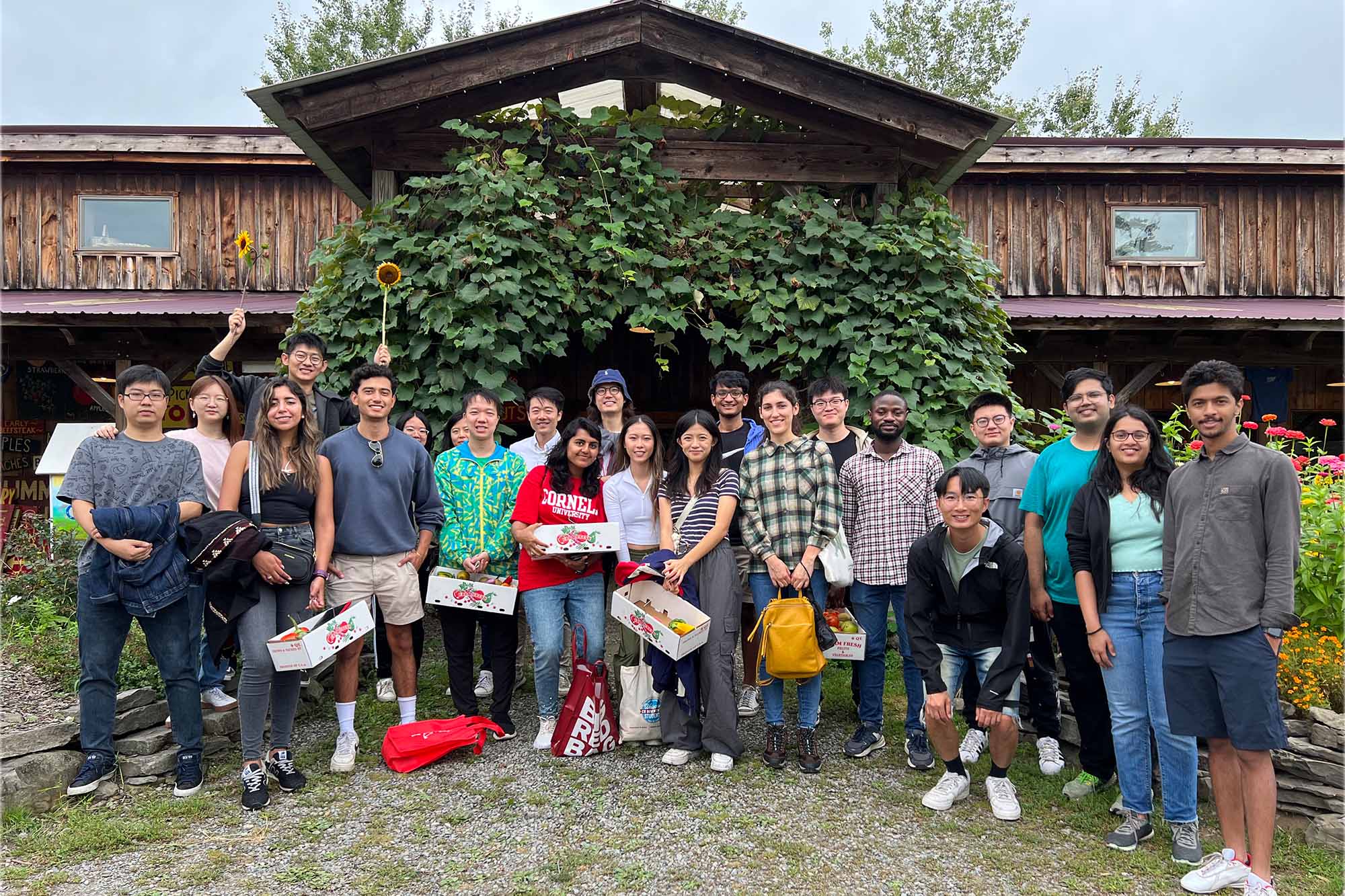 Students stand together at Indian Creek Farms for an apple picking event hosted by CBE Women.