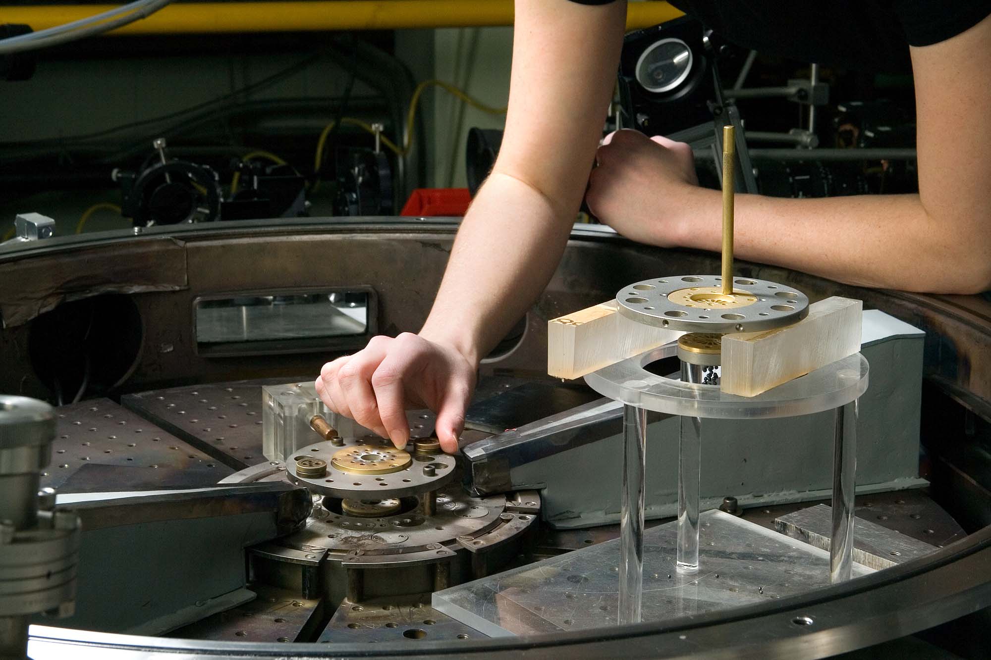 A student adjust equipment at the lab of plasma studies.