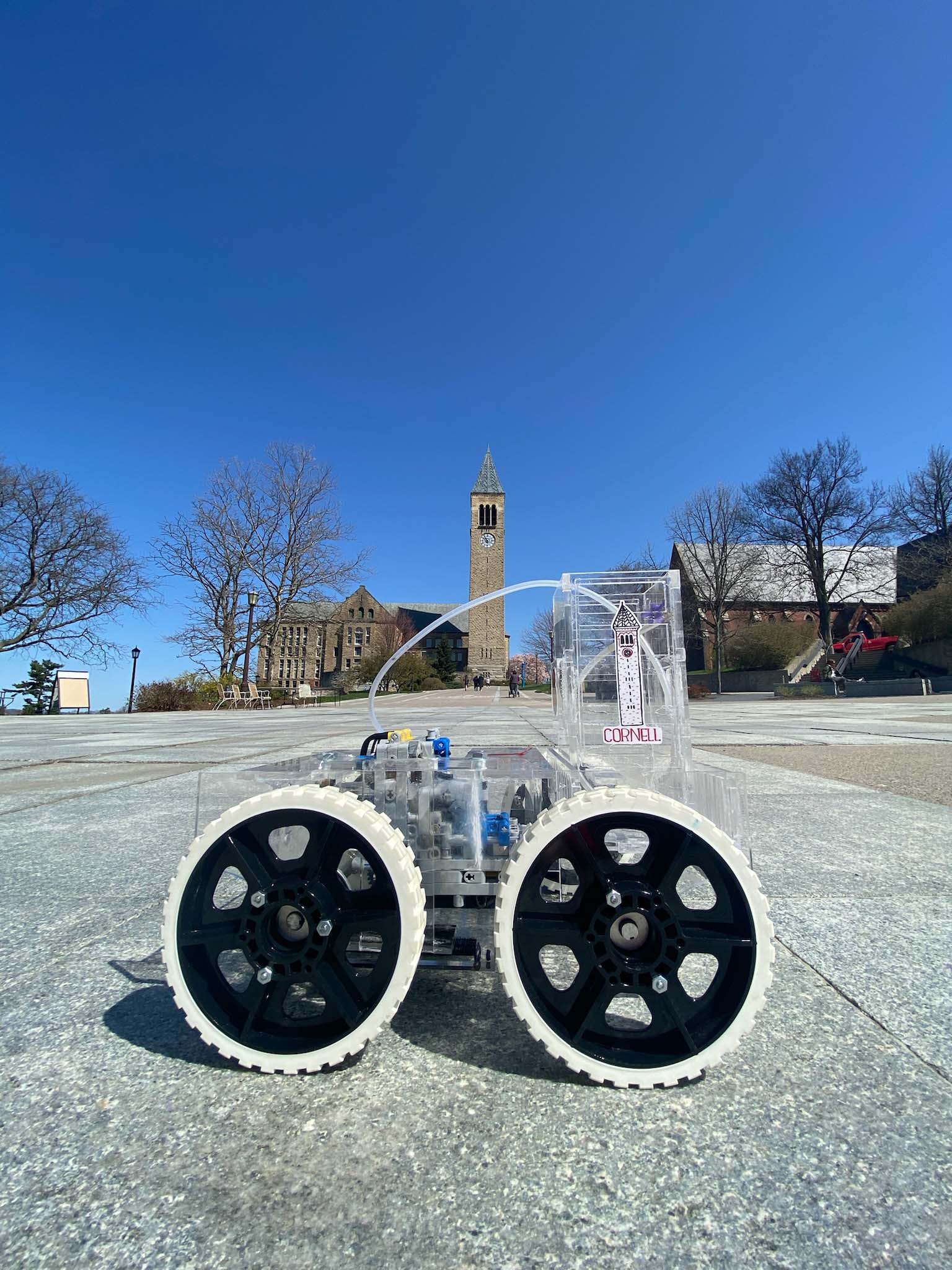 ChemE car outside on Ho Plaza with Cornell clocktower in the background.