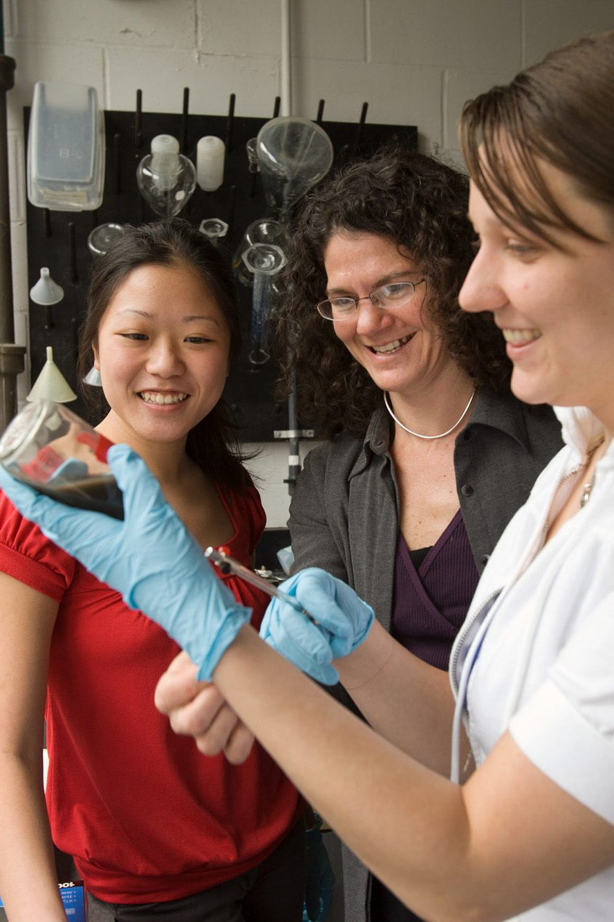 Ruth Richardson and students looking on in lab