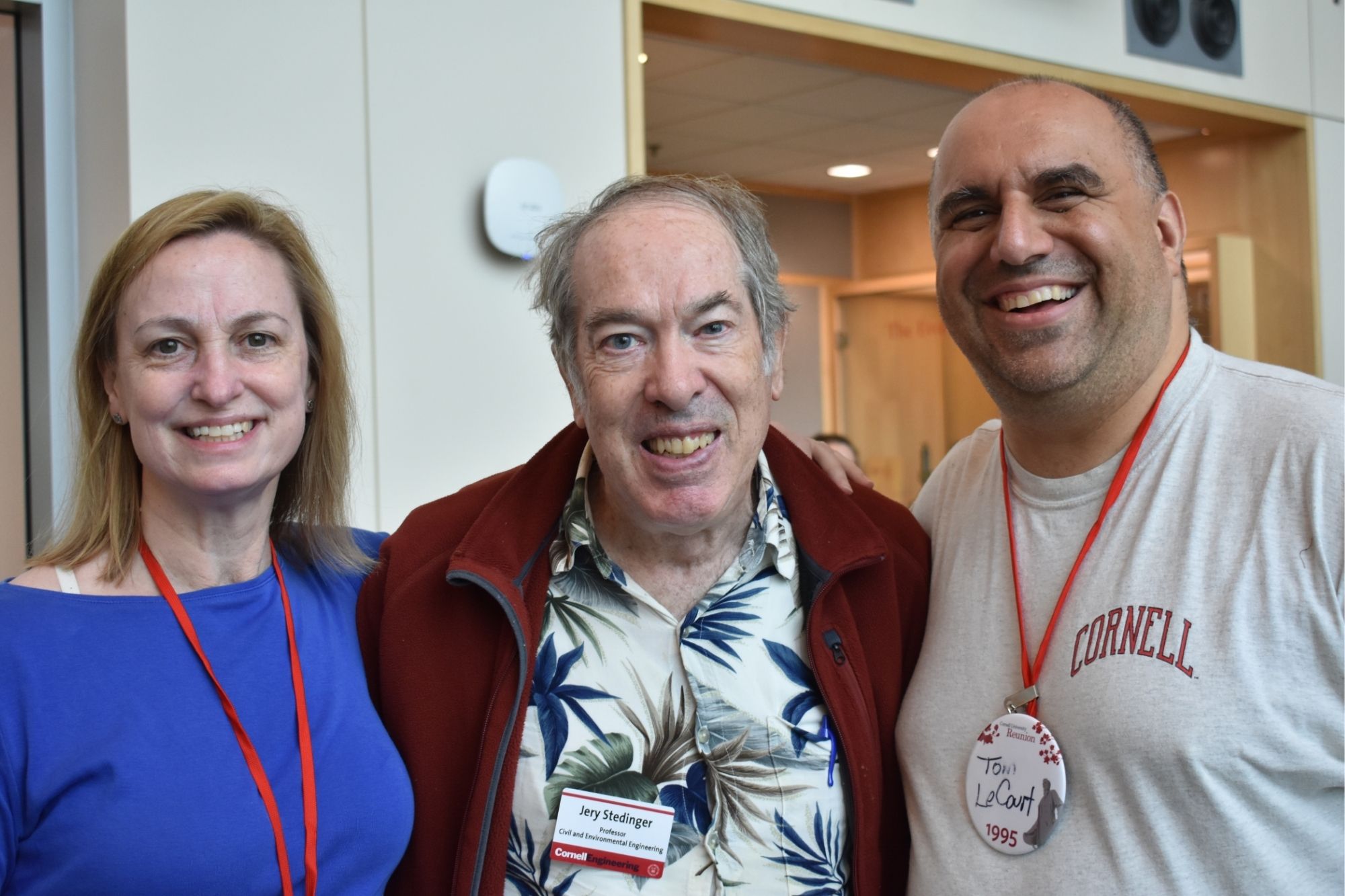 Three alumni posing for a photo together and smiling during CEE Reunion 2025