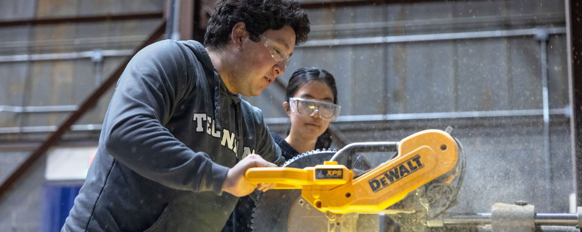Current students in the American Society of Civil Engineers work in Cornell's High Voltage Lab on Mitchell Street to build new parts for the Flat Rock Bridge.