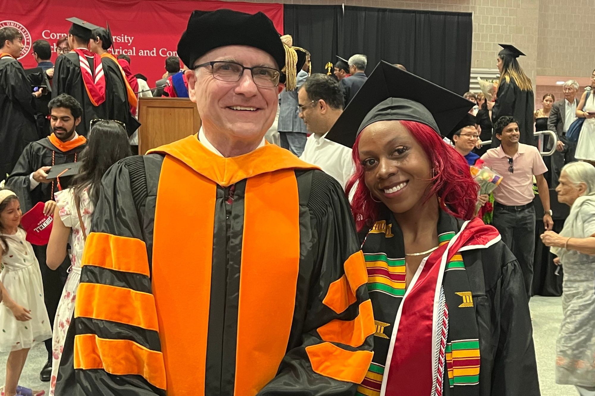 Joe Skovira with a student in graduation regalia at the 2024 commencement.