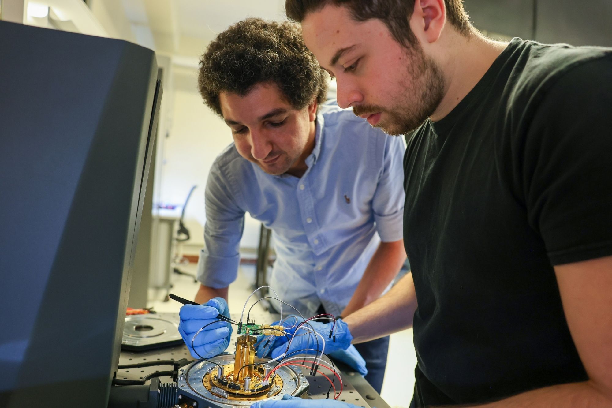 Mohamed Ibrahim with student in his lab.