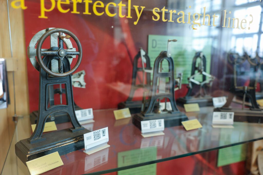Mechanisms in a display case in Duffield Atrium