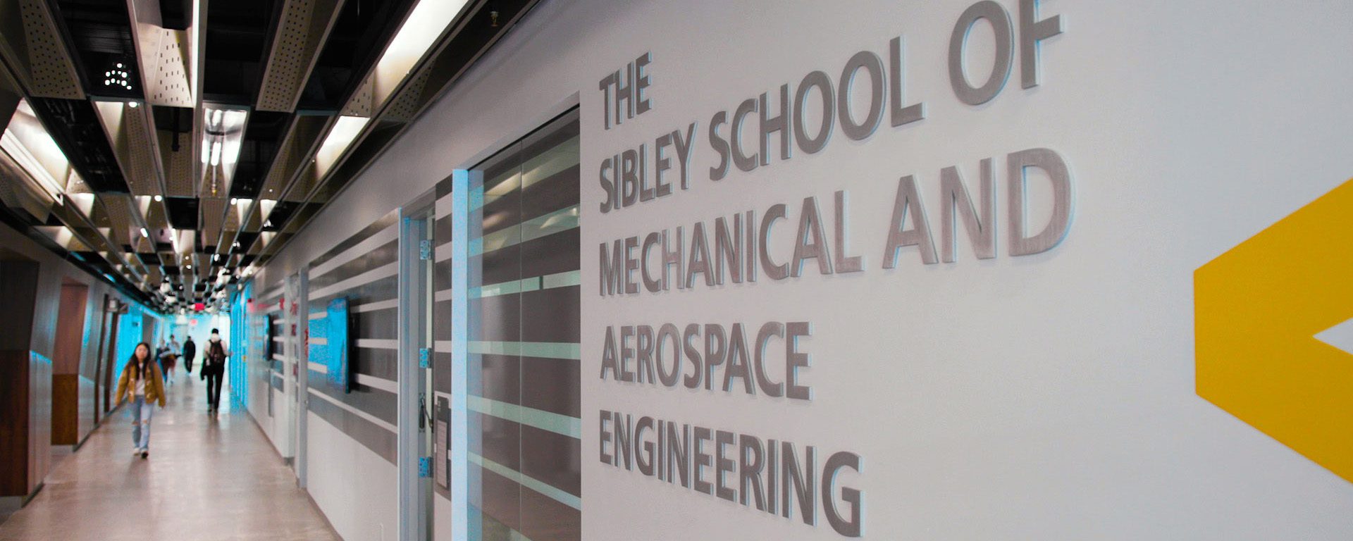 Hallway with writing on the wall that reads The Sibley School of Mechanical and Aerospace Engineering