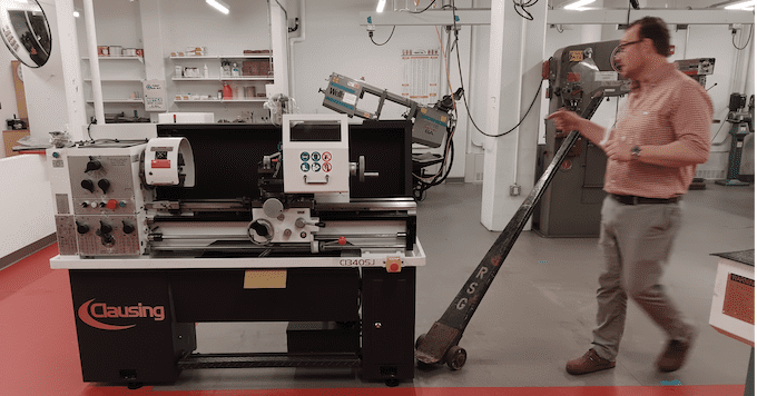 Vincent Chicone moves a new machine into place.