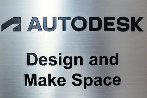 Metallic sign saying "Autodesk Design and Make Space"