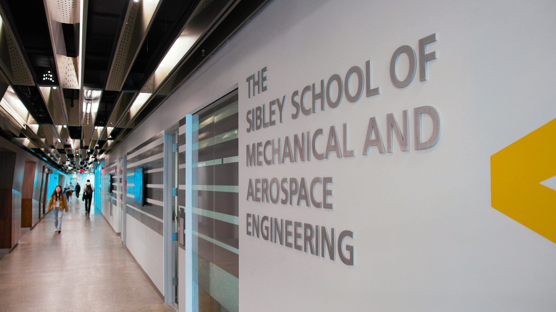 Hallway on the ground floor of Upson Hall. Words on the wall say The Sibley School of Mechanical and Aerospace Engineering.