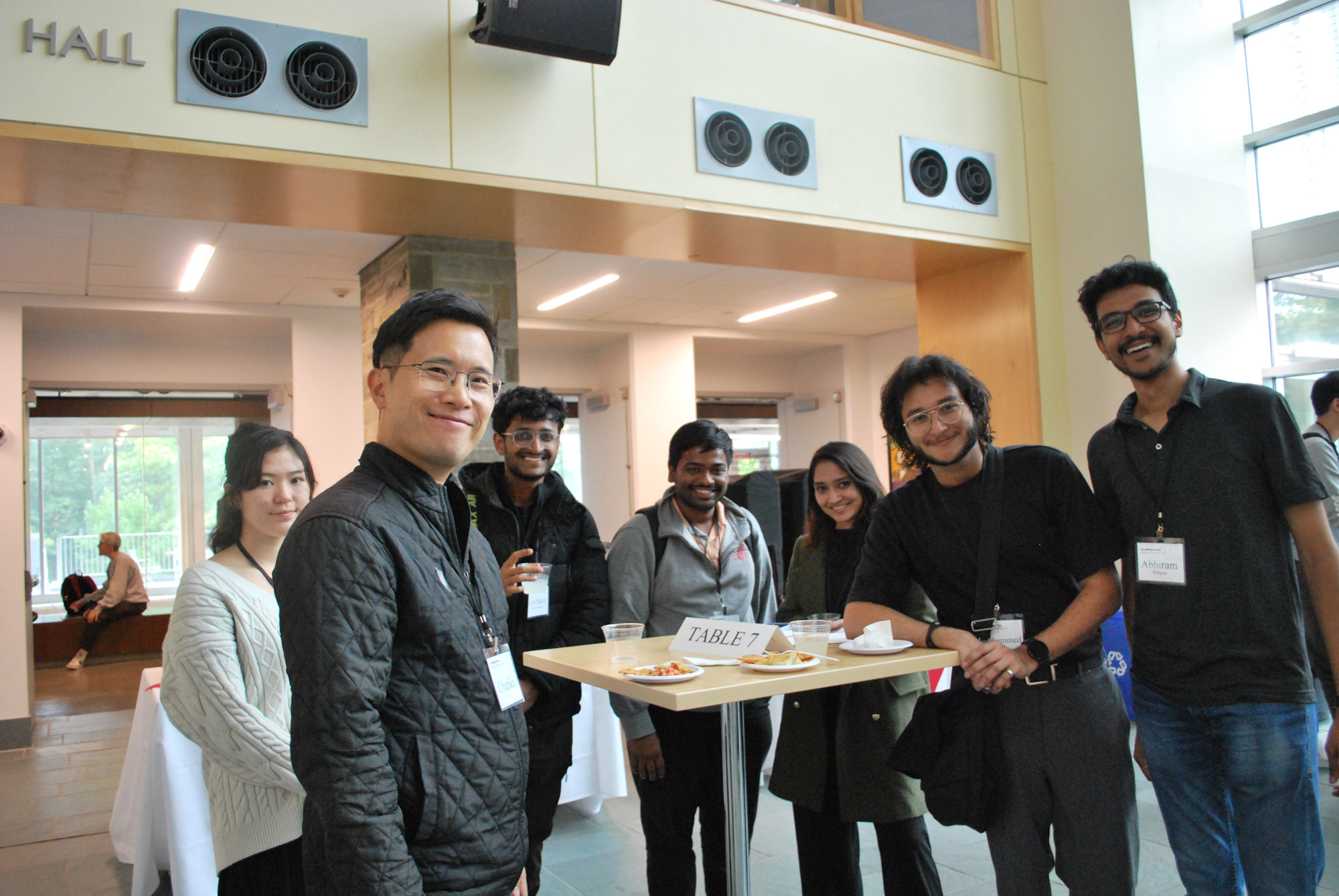 Students standing at a table during the engineering management networking reception in Duffield Hall