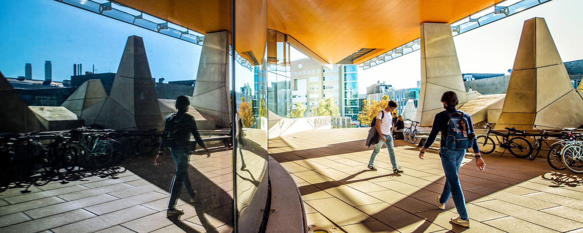 Computing and Information Science (CIS) students outside modern Gates Hall.