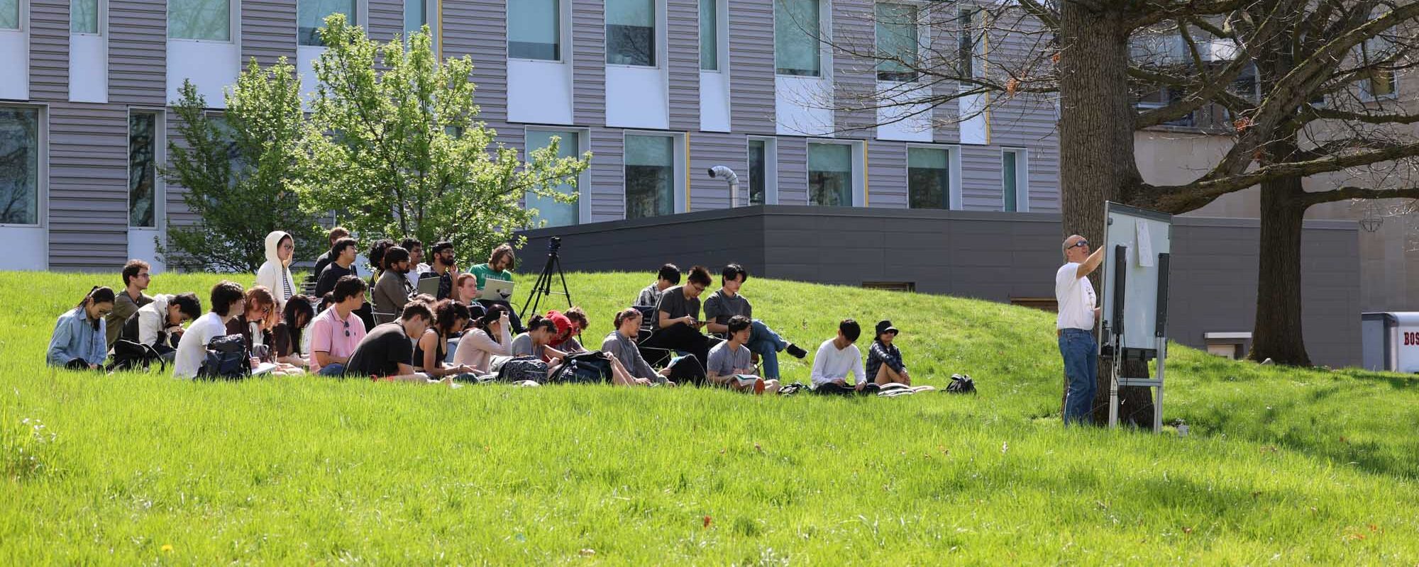Professor Darrell Schlom teaching class out on the Pew Engineering Quad