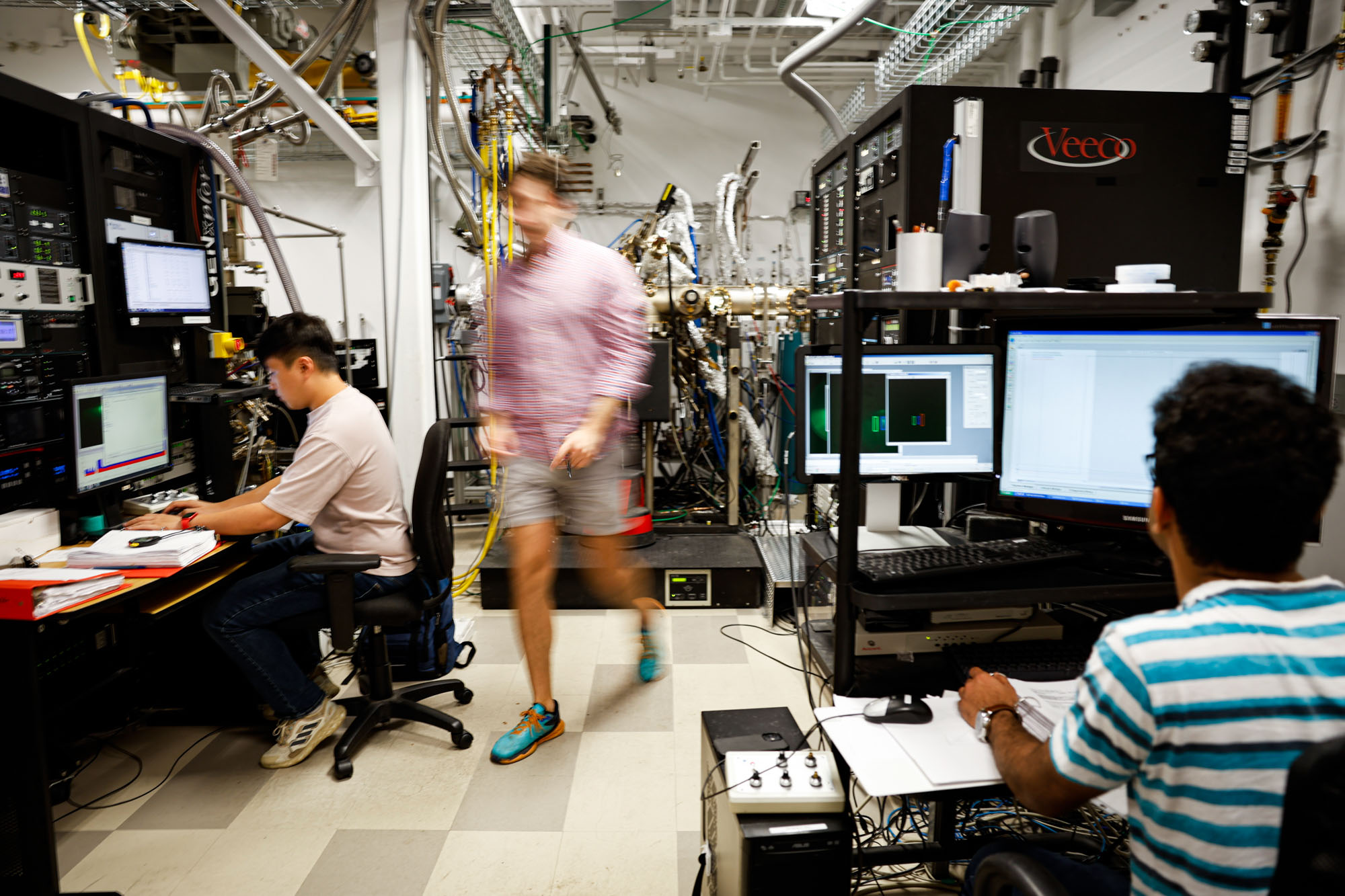 Students working on computer in Professor Grace Xing's lab