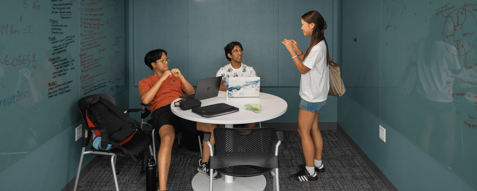 Students gathering in a study space in Tang Hall.