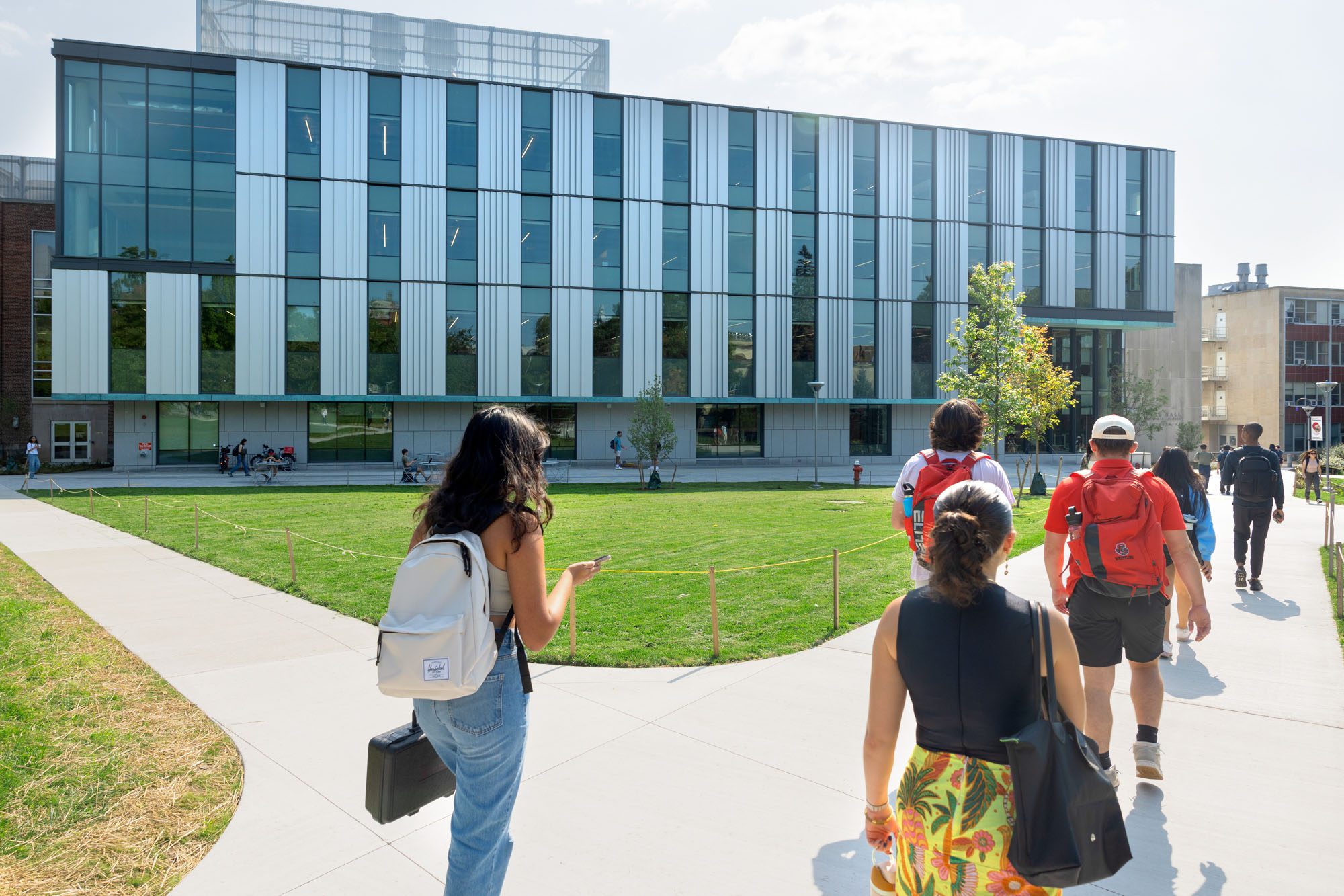 Students walking on the engineering quad outside of Tang Hall.