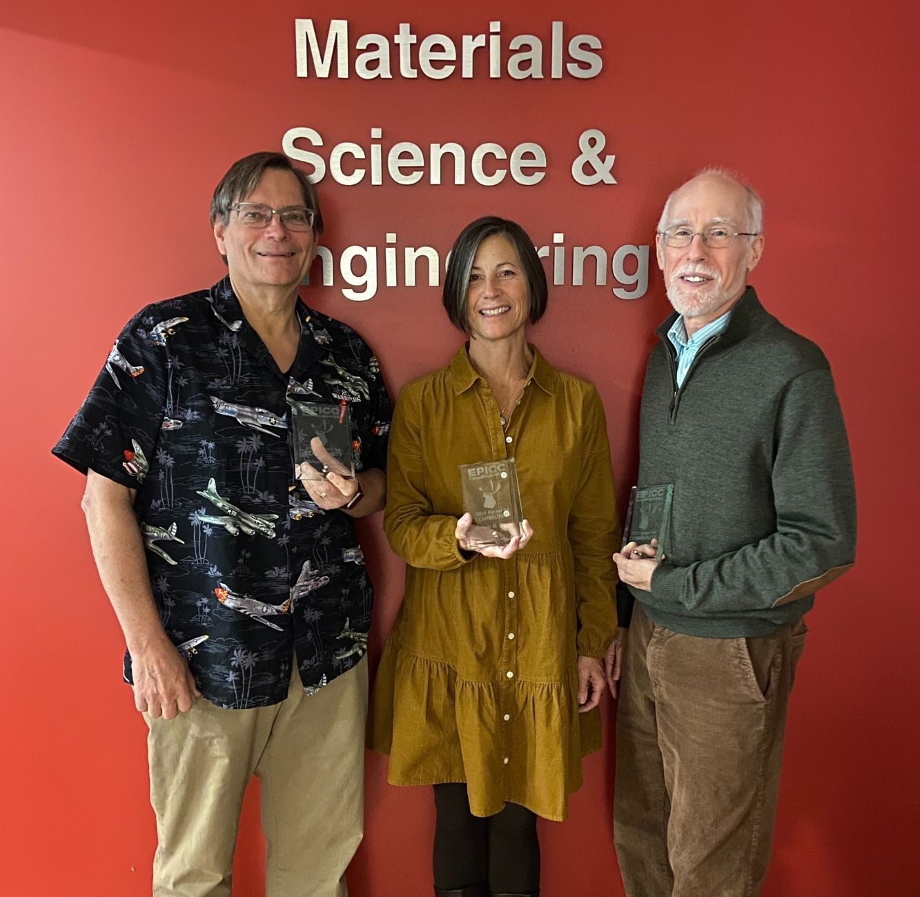 Michele Conrad, Kit Umbach, and Mike Thompson pose with their EPICC awards for community