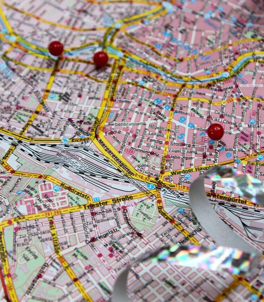 a map with three red dots marking locations