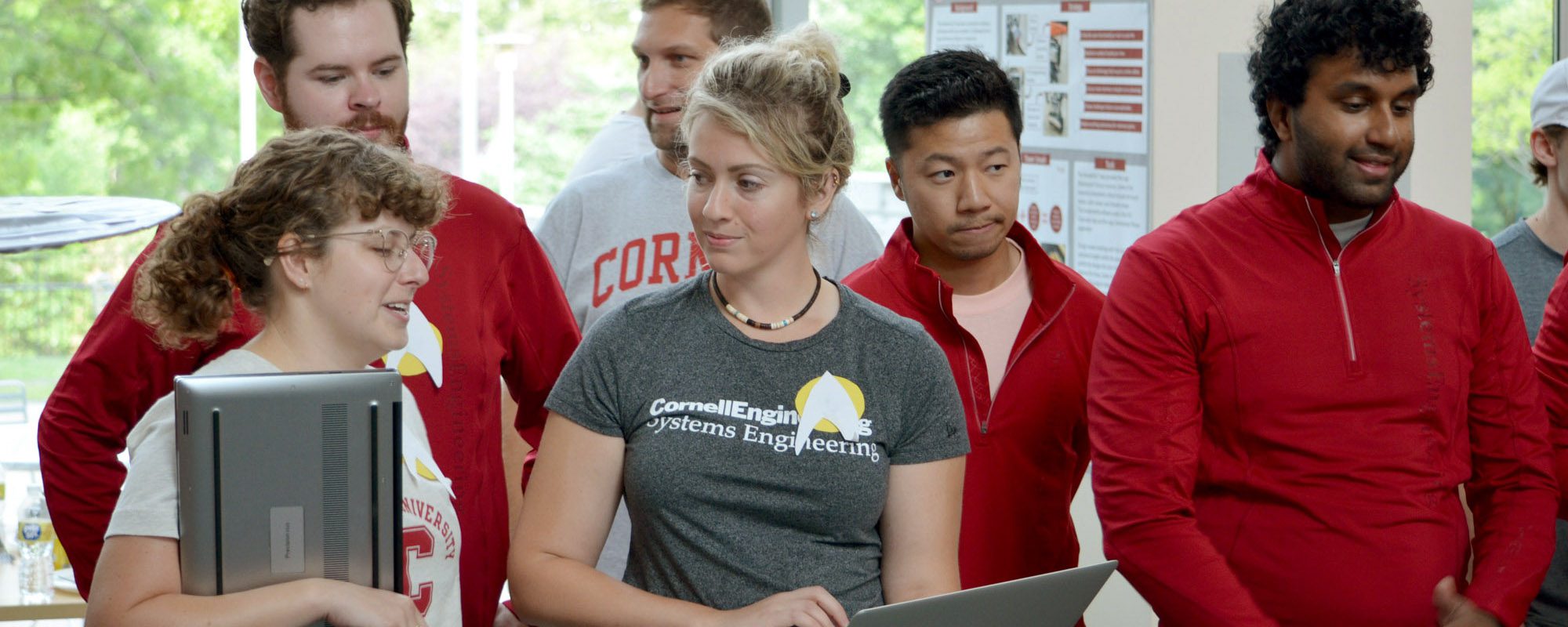 Six distance learning students watch the SYSEN 5920 competition in Duffield Hall.