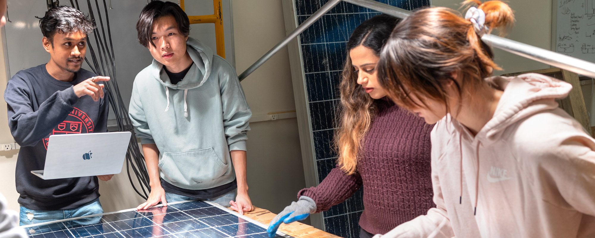 Students work with solar panels