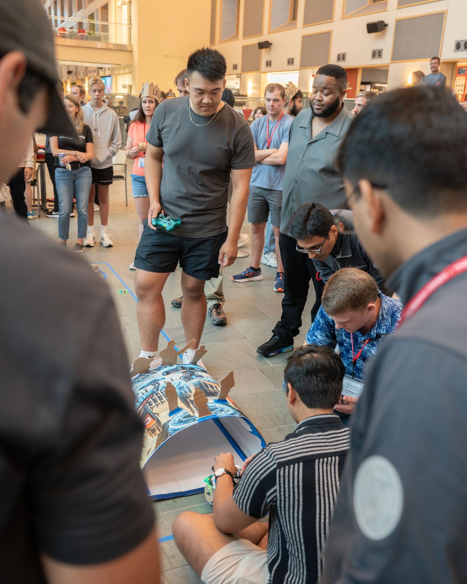 students operate a robot in Duffield hall