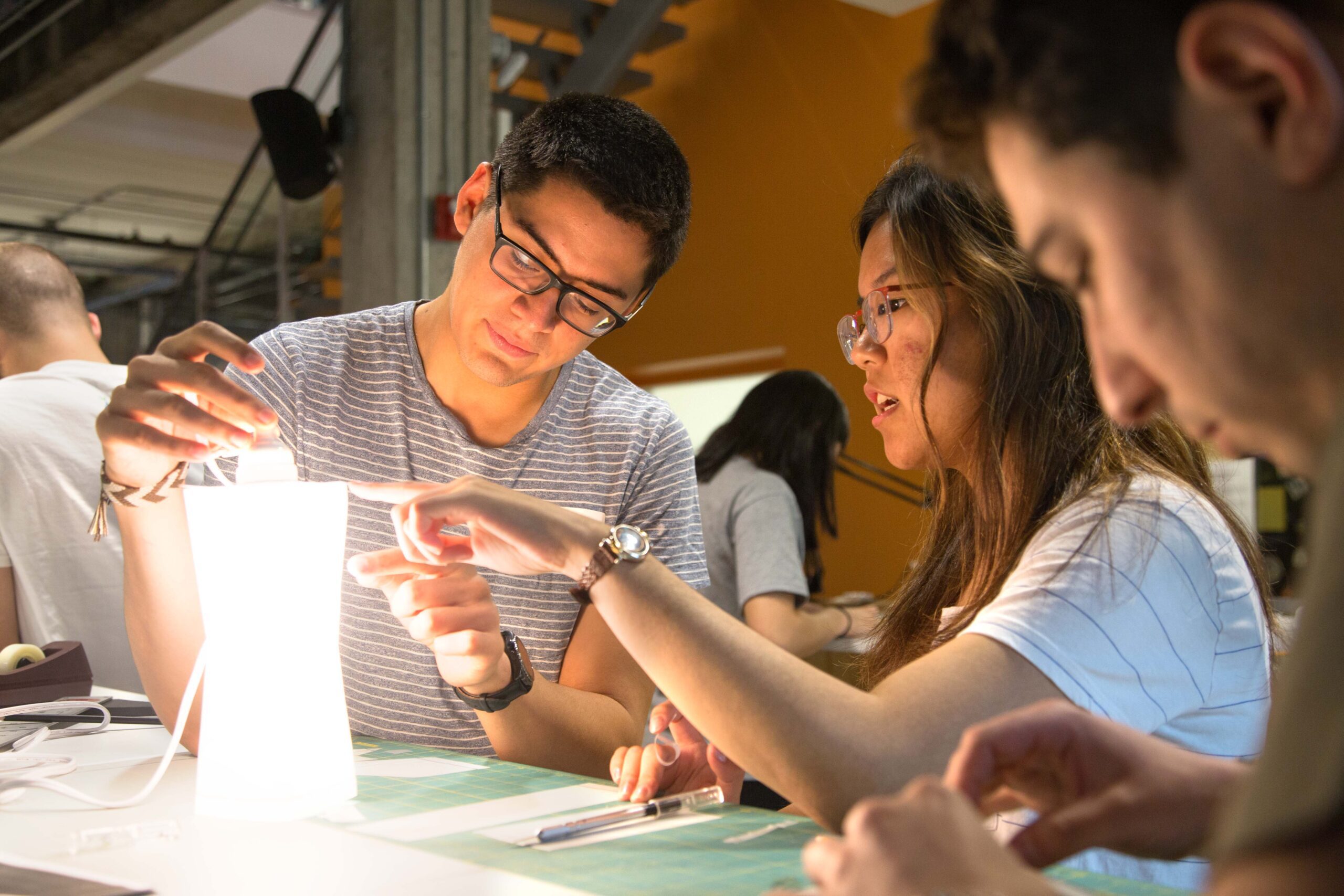 M.Eng. students in the lab working on a project