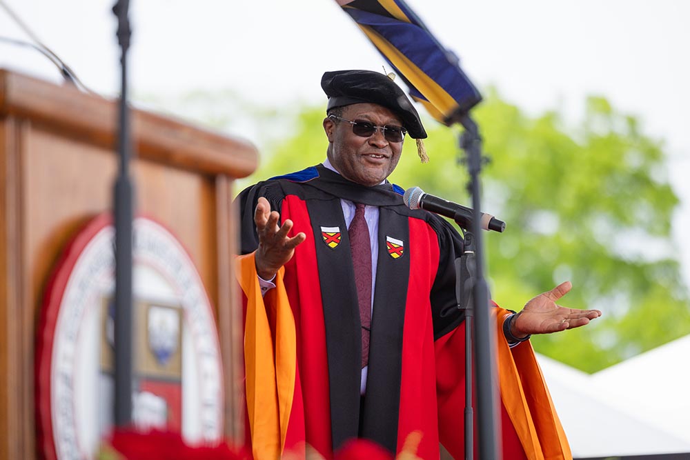 Dean Lynden Archer speaks to graduates during commencement