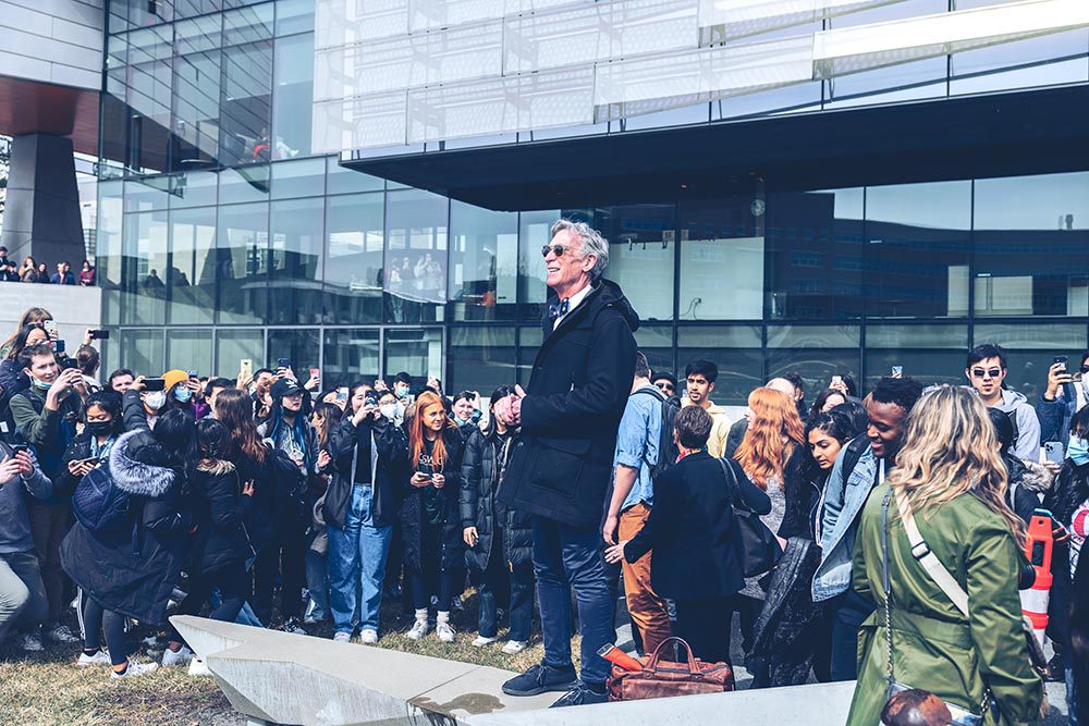 Bill Nye speaks enthusiastically to engaged students in front of the Bill Nye solar noon clock