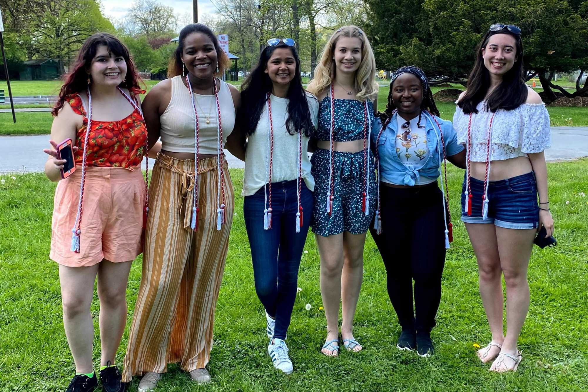 Engineering Learning Initiatives Peer Educators with graduation cords