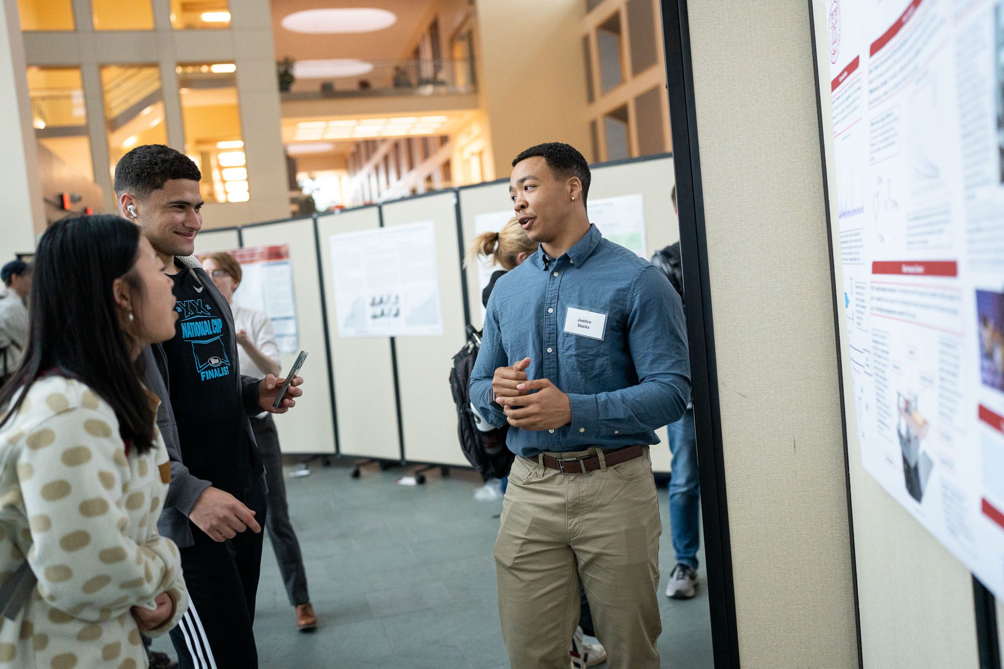 Justice Starks presents his research at a poster session