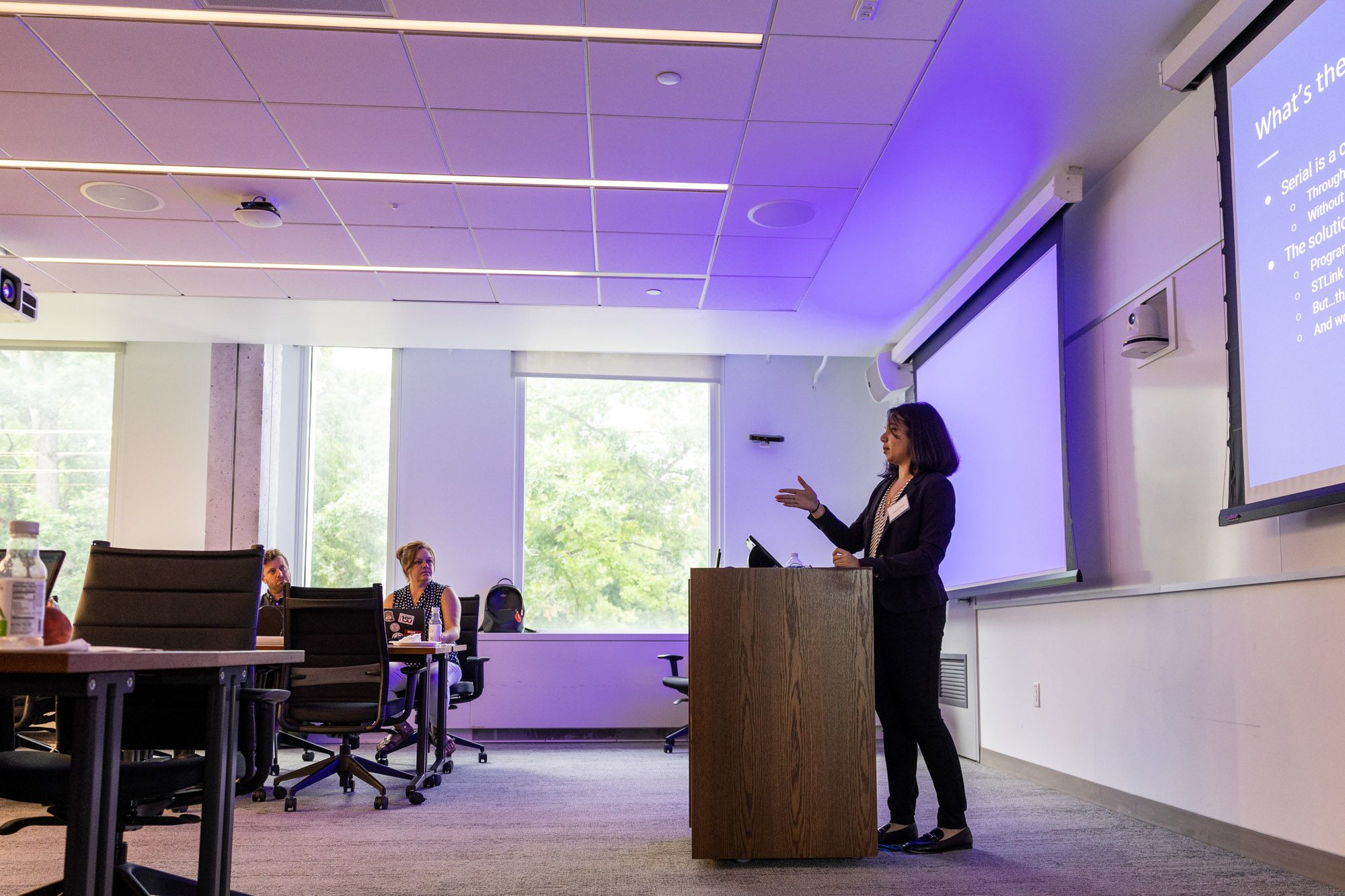 An undergraduate student gives a research presentation