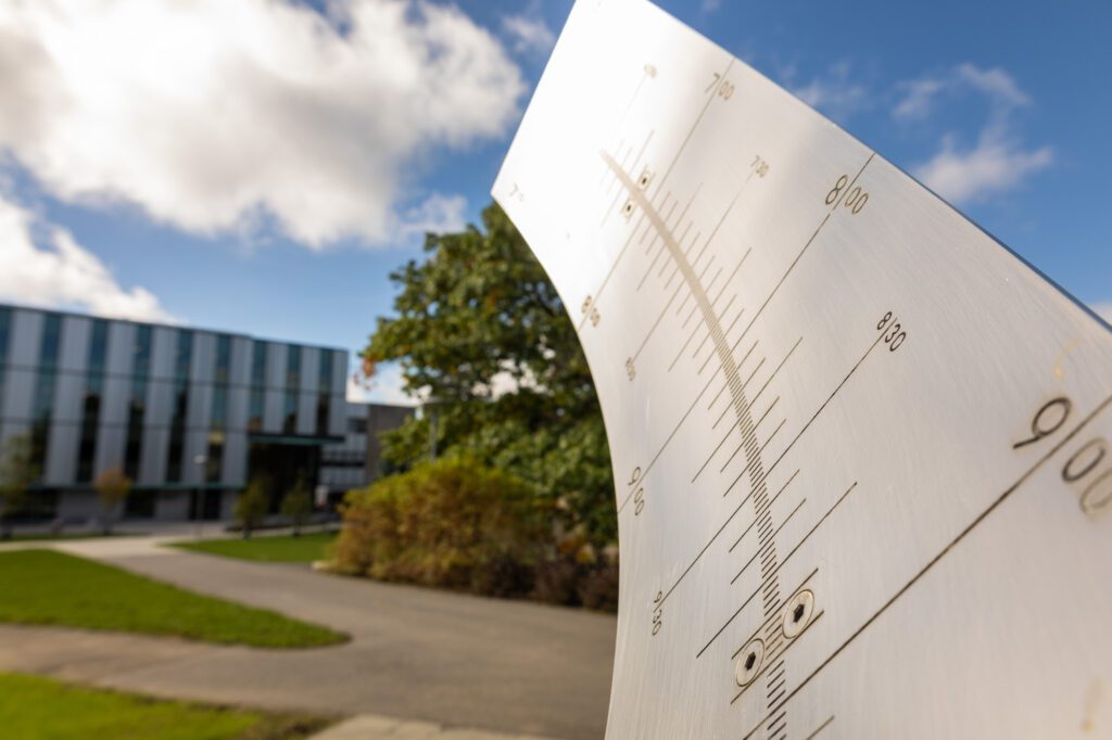 The sundial extends toward Tang Hall