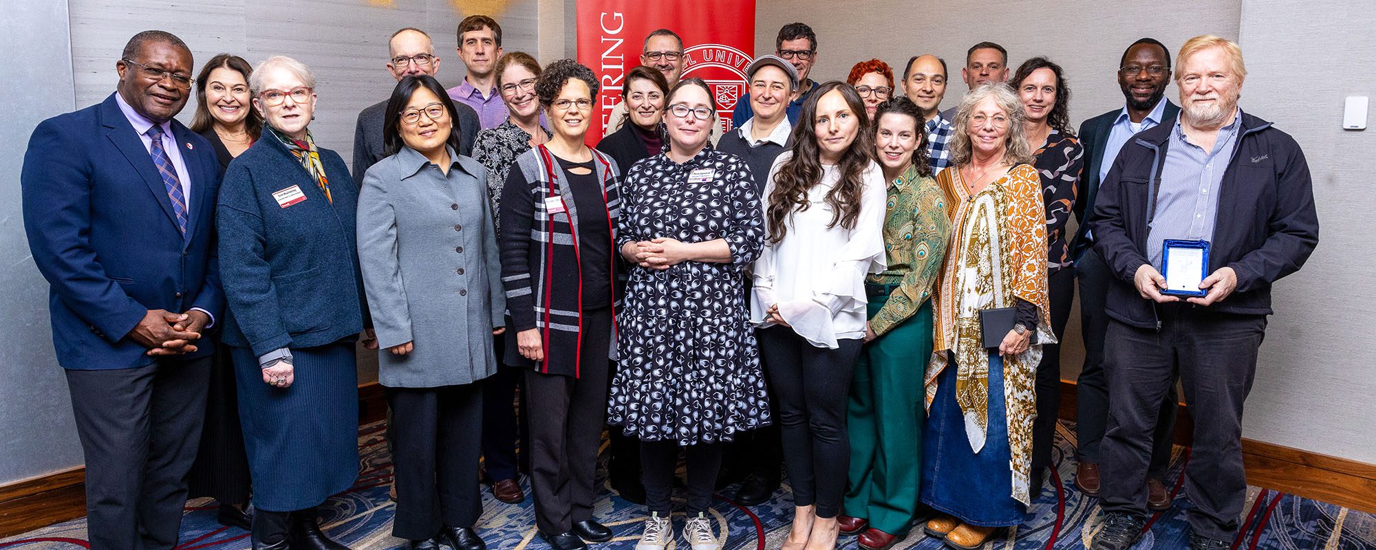 Faculty and staff awardees pose for a photo with Dean Lynden Archer at the EPICC Awards