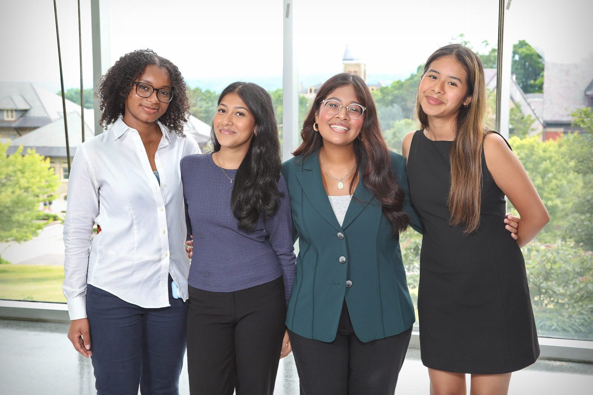 4 students in the Cornell Pre-Collegiate Summer Scholars Program pose for a photo