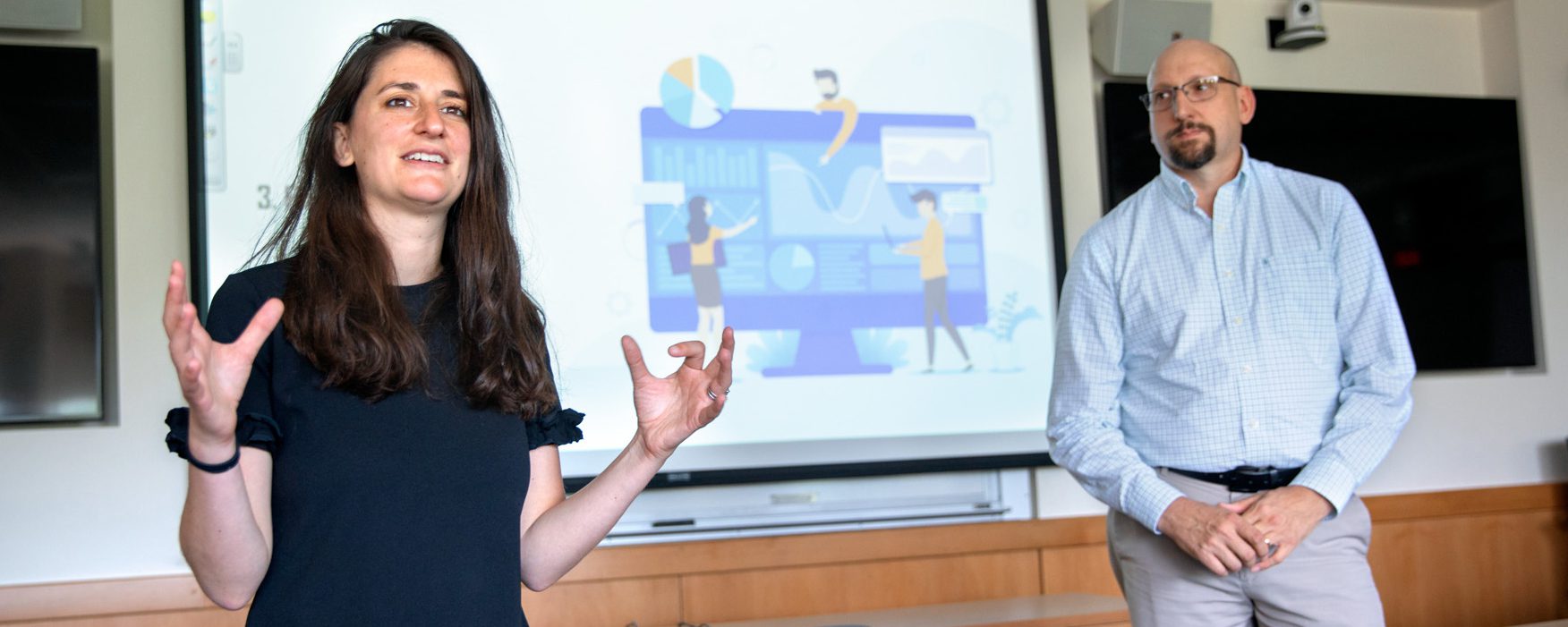 Andrea Ippolito and Robert Newman give a presentation