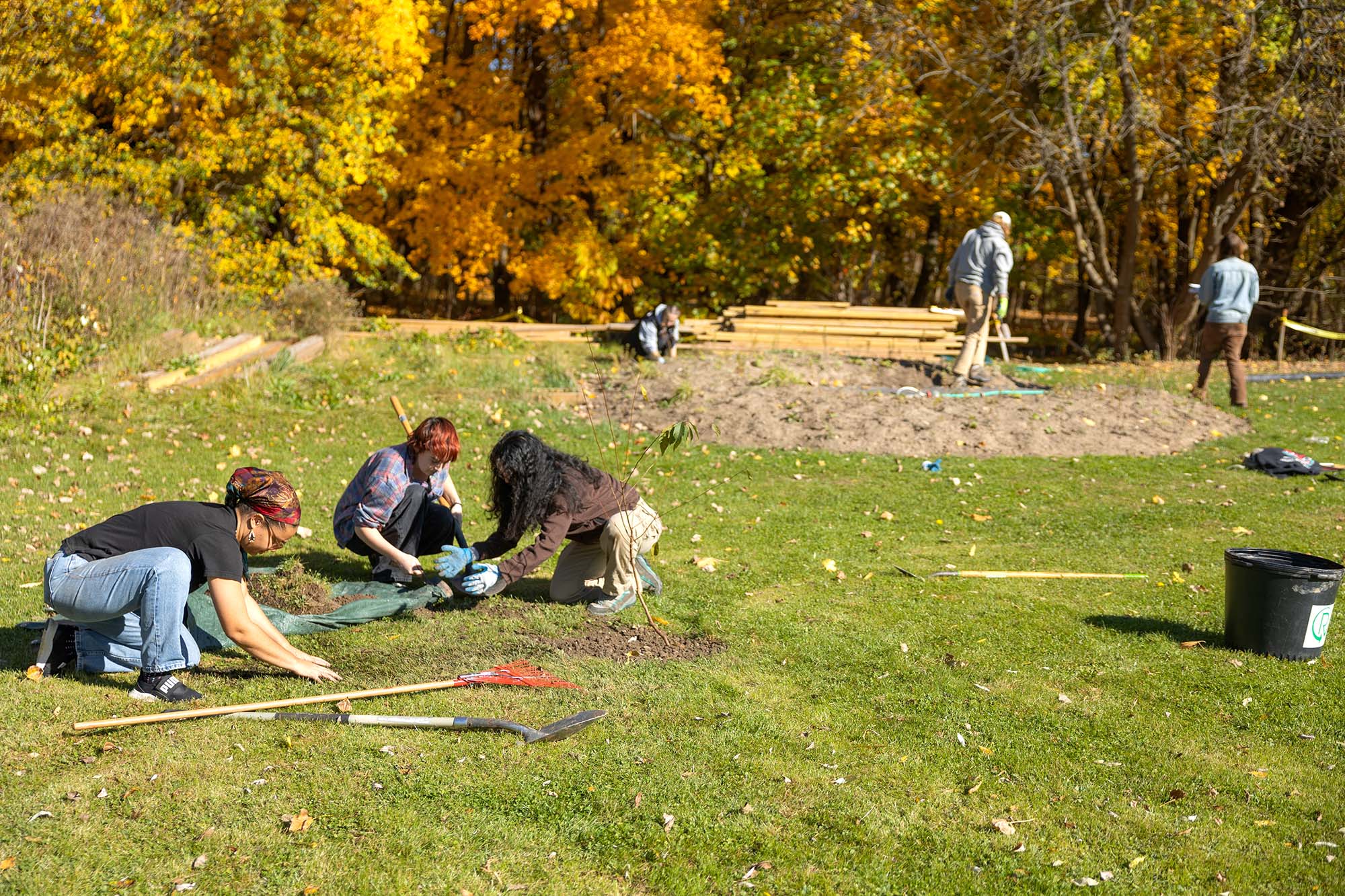 Students work to install a medicinal garden at Onondaga Nation School