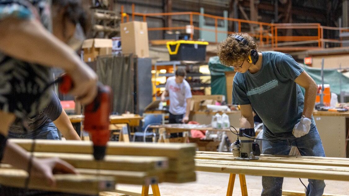 Current students in the American Society of Civil Engineers work in Cornell's High Voltage Lab on Mitchell Street to build new parts for the Flat Rock Bridge. The student chapter of the American Society of Civil Engineers (ASCE) built the Flat Rock pedestrian bridge in 1983 - now the current ASCE students are working to renovate it for the next 40 years, with the help of alumni from the class of '83, retired and current faculty from the department of civil and environmental engineering, and the local Ithaca ASCE chapter.